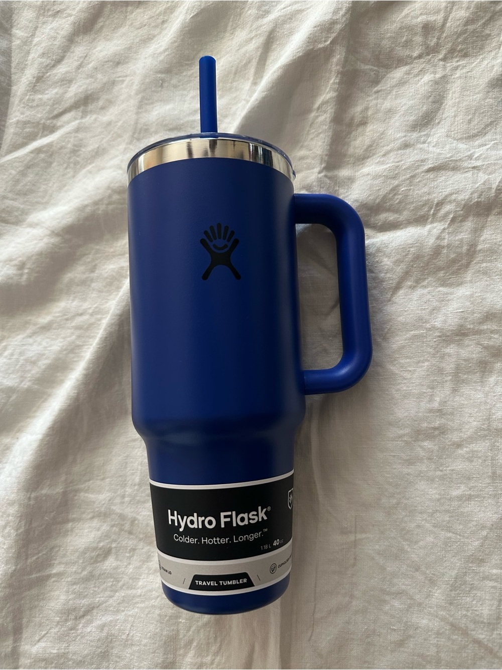 Hydro Flask deep blue travel mug with handle and straw